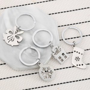 Christmas hollow metal keychain set with bell, snowflake, gift box and sock charms