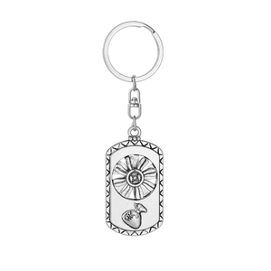 Detailed close-up of rotating silver metal sunflower keychain with money bag design