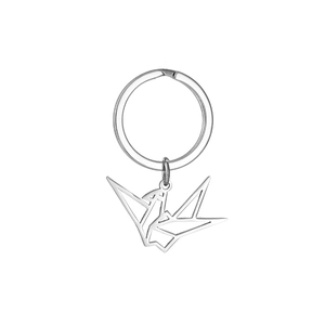 Close-up of minimalist silver hollow origami crane pendant keychain made of stainless steel