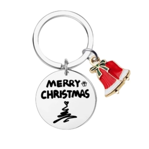 Christmas keychain with Merry Christmas engraved tag and red bell pendant on white background