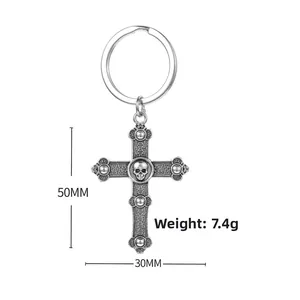 Detail view of retro skull cross keychain showing 50mm height and 30mm width dimensions