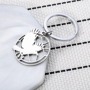 Karasuno Haikyuu stainless steel keychain with crow silhouette on a white mesh background