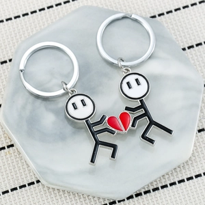 Cute magnetic heart matchstick couple keychain in black and white enamel finish