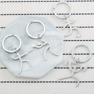 Polished stainless steel sports matchstick figure keychains featuring various athletic poses