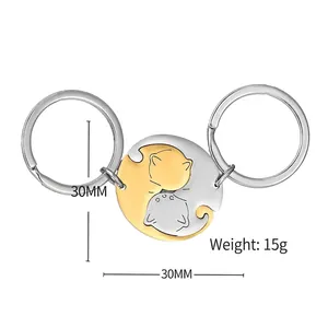 Rotating stainless steel cat keychains in gold and silver with yin yang puzzle design