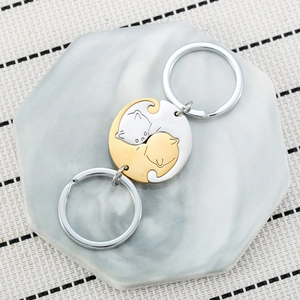 Rotating stainless steel cat keychain set for couples in polished gold and silver finishes