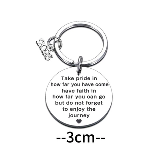 Polished stainless steel 2026 graduation keychain with circular engraved quote pendant