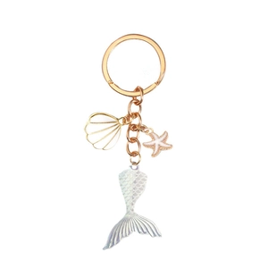 Elegant gold mermaid tail keychain with white enamel shell and starfish charms