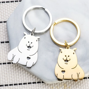 Polished silver and gold Capybara stainless steel couple keychains with heart cutouts