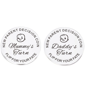 Macro view of newborn decision coin featuring Mummy's Turn and Daddy's Turn text