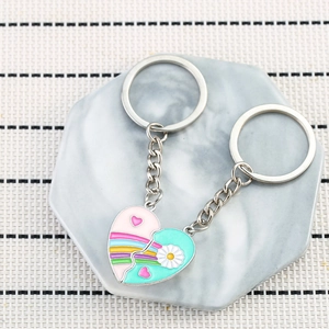 Magnetic heart-shaped rainbow keychain set for couples with daisy design and metal rings