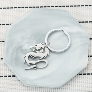 Minimalist silver dragon metal keychain with hollow design and polished steel finish