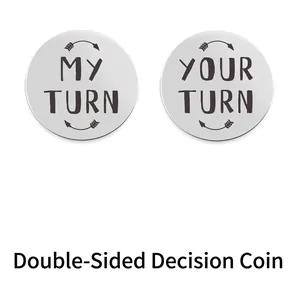 Detailed macro view of the double-sided My Turn and Your Turn stainless steel decision coin