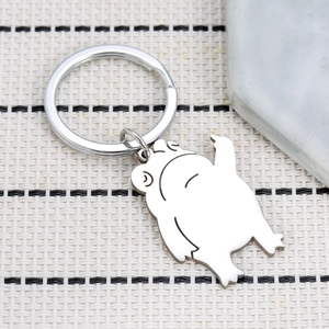 Quirky silver metal Pepe the Frog keychain with a polished minimalist stainless steel finish