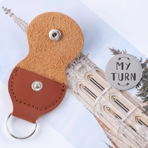 Brown leather keychain pouch with metal snap button and My Turn stainless steel coin
