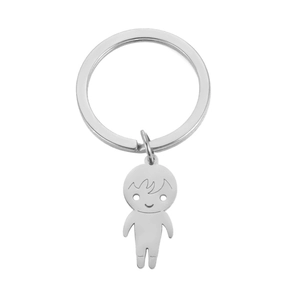 Detailed view of polished stainless steel cartoon boy keychain with mirror finish surface