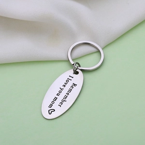 Polished stainless steel oval keychain with Remember I Love You Mom engraving and heart