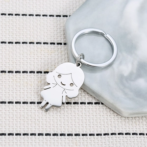 Polished stainless steel cartoon girl keychain on decorative marble and woven texture