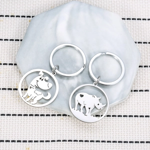 Lot de porte-clés en acier inoxydable avec charmes évidés chien et rhinocéros
