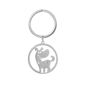 Vue détaillée d'un porte-clés rond en métal avec un motif évidé de chien mignon