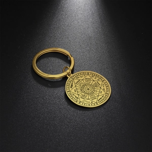 Gold stainless steel keychain with circular Seven Archangels Seal engraving in detail