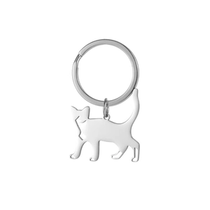 Close-up of minimalist black cat silhouette keychain made of polished stainless steel