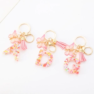 Pink resin alphabet keychains A D G with glitter hearts pink tassels and butterfly charms
