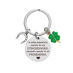 Polished stainless steel keychain with four-leaf clover and horseshoe charms for success
