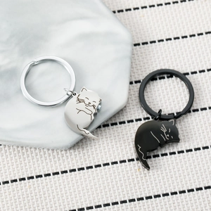 Magnetic cat keychain set in polished black and silver metal for couples gift