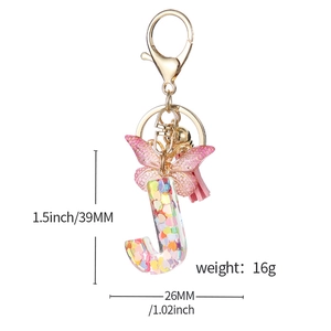 Pink heart sequins resin letter J keychain with butterfly and tassel charm details