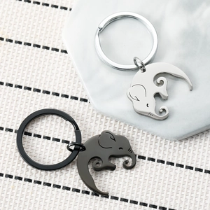 Matching pair of silver and black elephant stainless steel keychains for couples