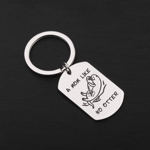 Polished stainless steel otter keychain with A Mom Like No Otter engraving on black background