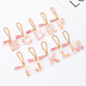 Colorful resin alphabet keychain with heart sequins and pink tassels for Stanley cups