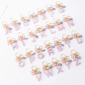 Purple glitter resin alphabet keychain set with 26 letters, gold butterfly and tassels