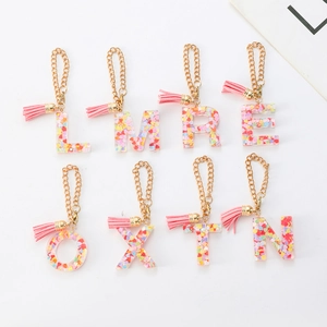 Stanley cup alphabet resin keychain with colorful heart sequins and pink suede tassel charm