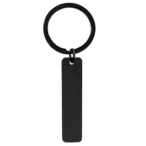 Minimalist matte black rectangular stainless steel keychain for custom engraving on white background