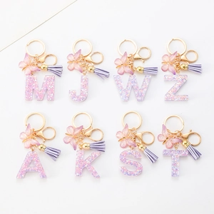 Purple resin alphabet keychain with gold butterfly charm and suede tassel for women handbags