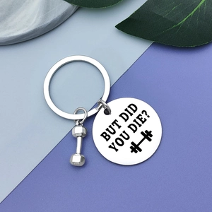 Polished stainless steel weightlifting keychain featuring a dumbbell and engraved round tag