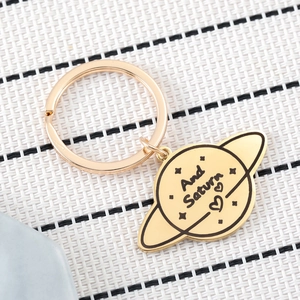 Golden planet Saturn keychain with stars and And Saturn engraving for couples