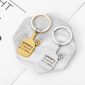 Polished stainless steel pickleball racket keychains in gold and silver finish