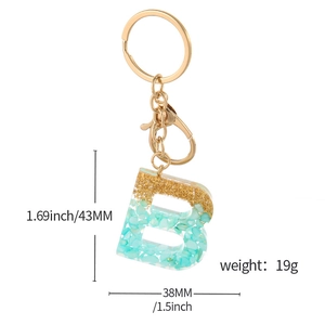 Resin letter B keychain with gold foil and blue stones, 1.69 inch height dimension
