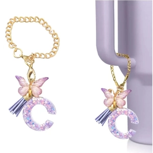 Purple resin letter C keychain with glitter, butterfly and tassel on a Stanley cup
