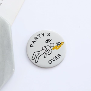 Round metal enamel coin with PARTY'S OVER text and beer illustration on silver finish