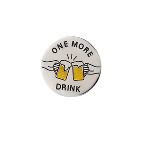 Detailed close-up of a metal decision coin featuring a colorful beer toast enamel design