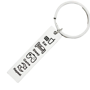 Silver stainless steel Eat Sleep Game Repeat keychain for gamers and teens