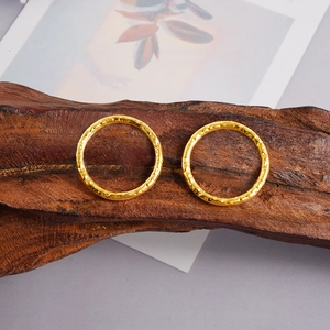 Pair of golden hammered circular earrings with 18k plating on 304 stainless steel