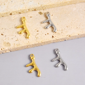 Detailed macro view of 304 stainless steel coral branch pendants in gold and silver finish