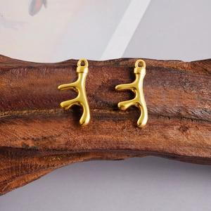 Golden 304 stainless steel coral branch pendants on textured wood with minimalist background