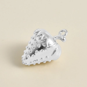 Macro view of a 304 stainless steel strawberry pendant with realistic surface texture