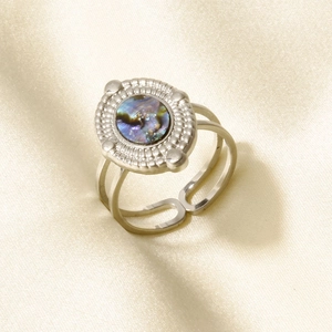 Detailed macro view of an adjustable stainless steel ring with an oval abalone shell inlay